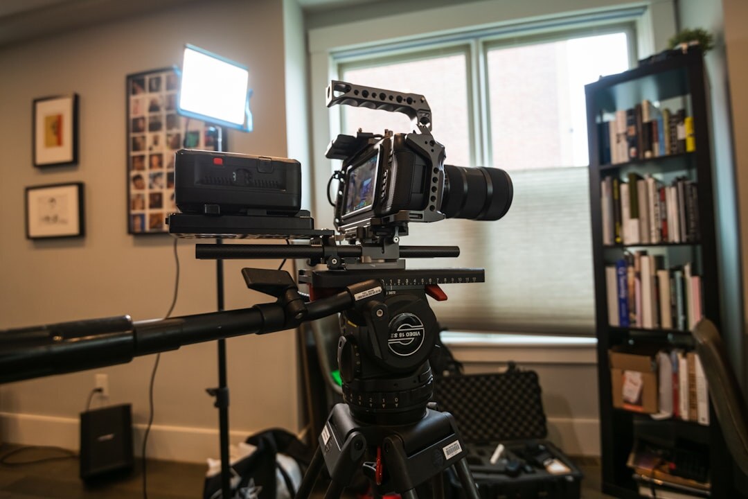 Professional broadcast camera on a tripod under studio lighting