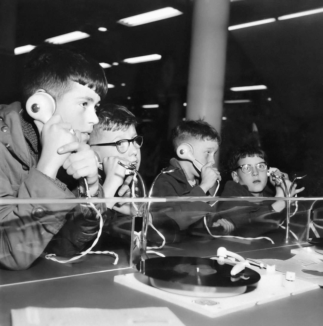 Journalists coordinating around a table with headsets before a live report